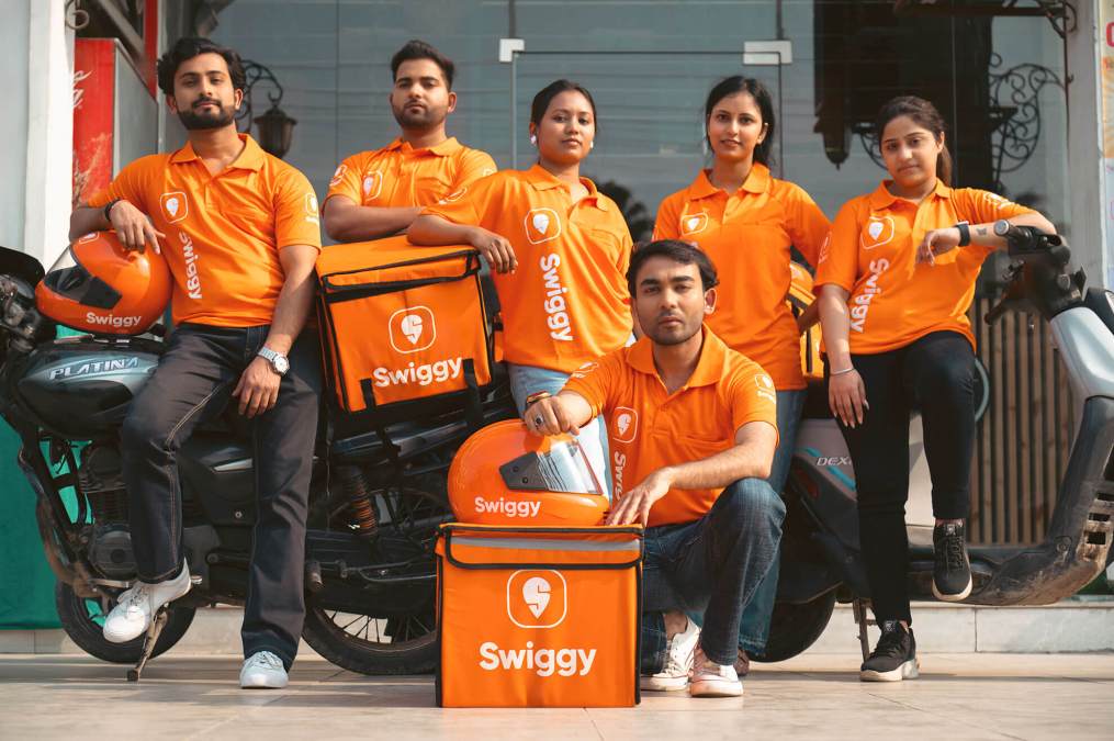 A photo of Swiggy delivery staff posing a picture