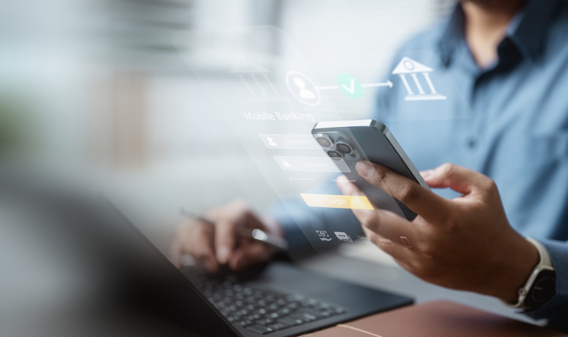 A photo of someone using a phone with a superimposed banking interface on top of them