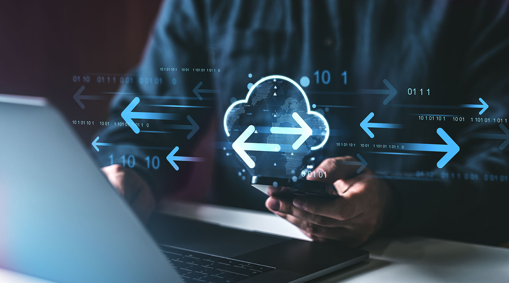 A photo of a someone using a mobile phone with a cloud data and arrow icons super-imposed on it